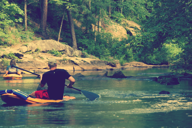 Kayaking In A Creek Of Rocks